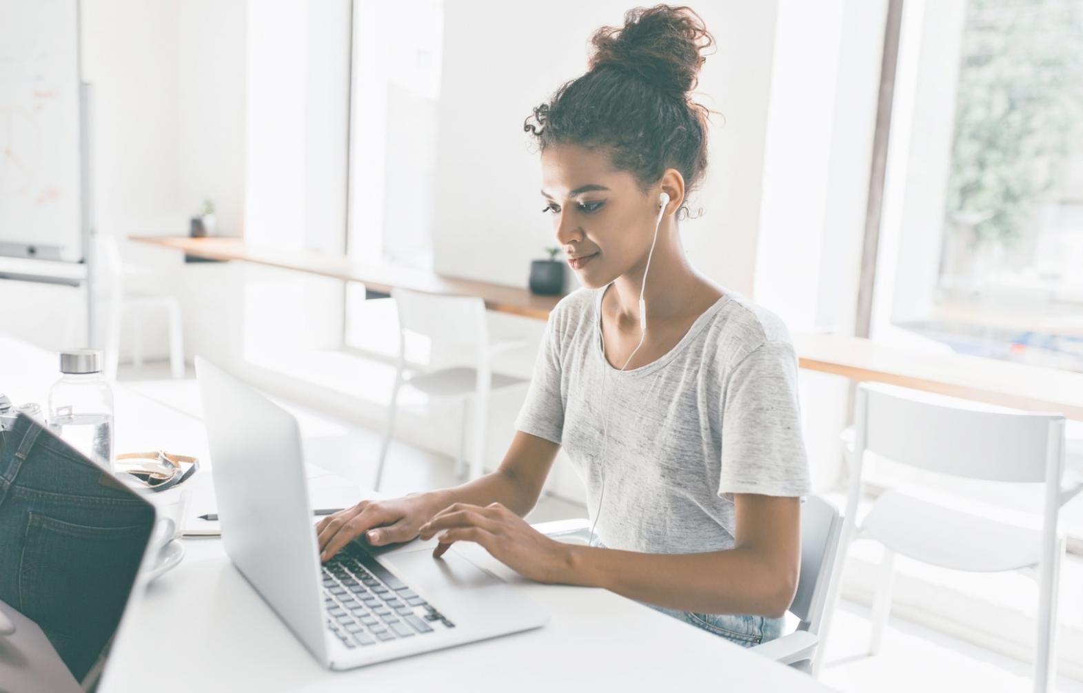Person reviewing financial documents at desk