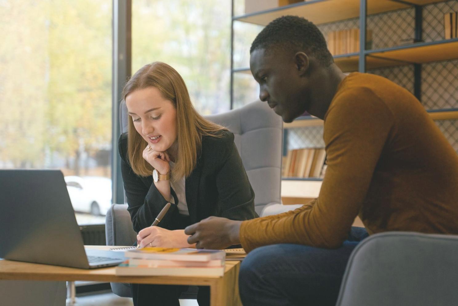 Business owner reviewing financial reports with confidence